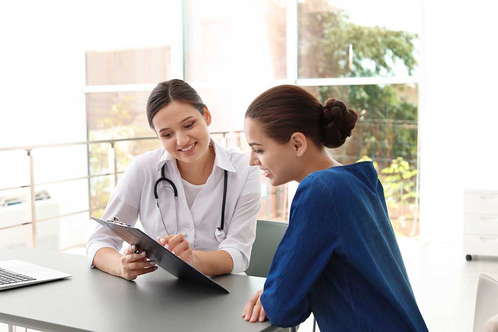Female doctor talking to a patient during a medical consultation