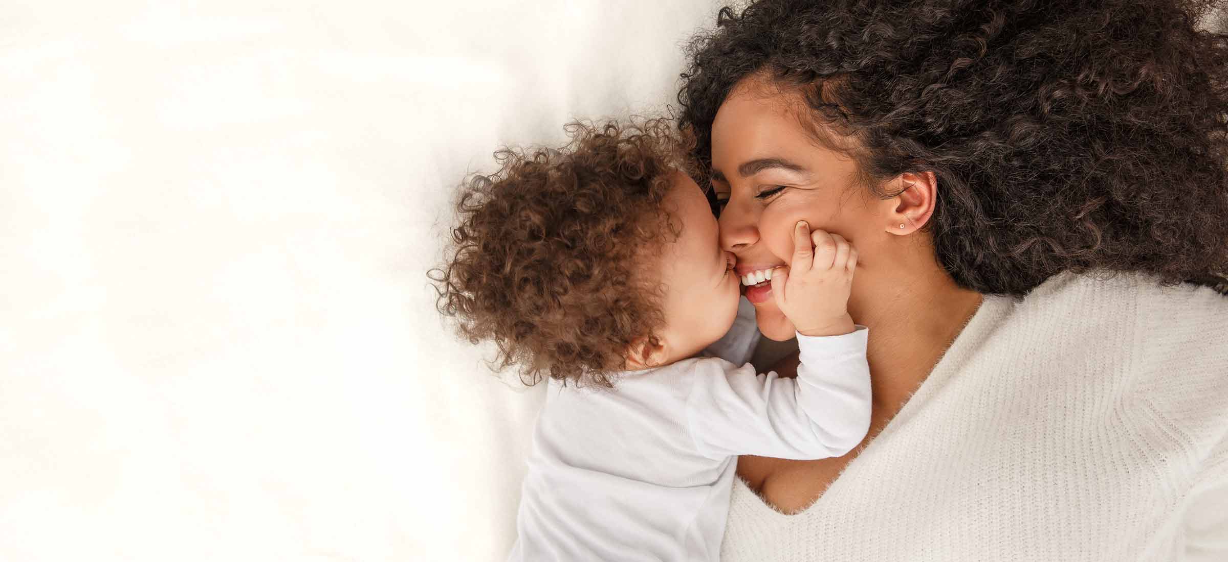 Lifestyle photo of a mother and baby depicting family life at home.