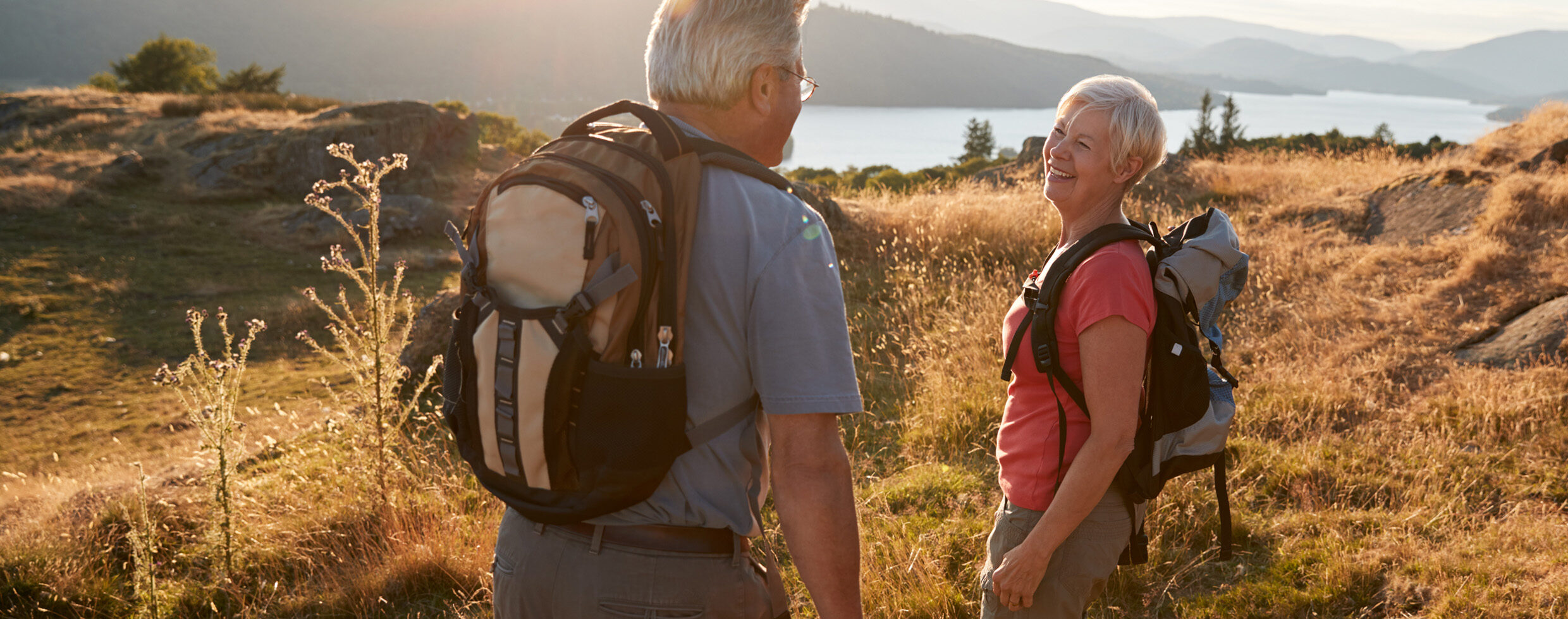 A man and a woman hiking outdoors
