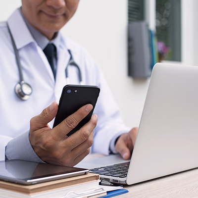 Doctor holding a phone.