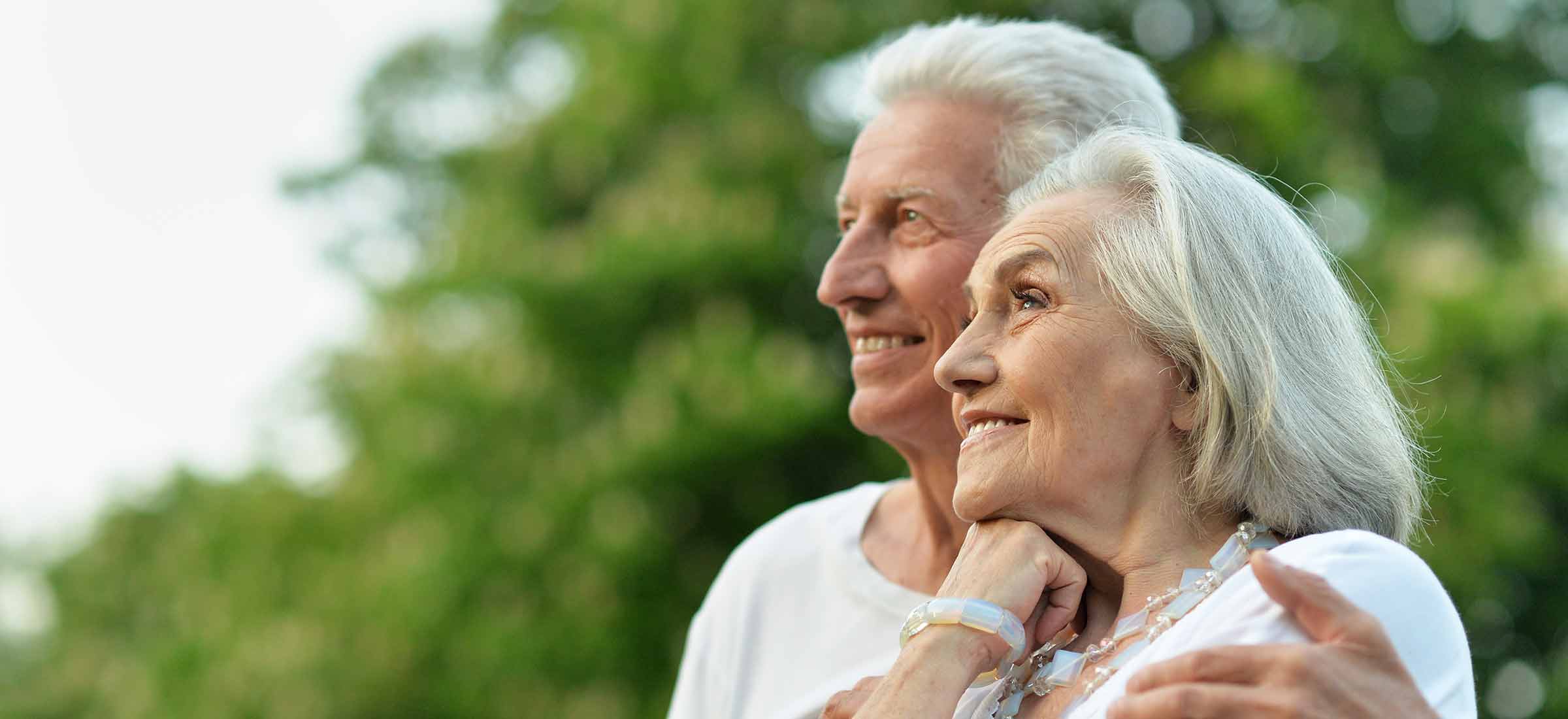 Portrait of beautiful senior couple posing in the park.