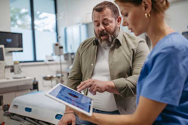 Person with a doctor and tablet