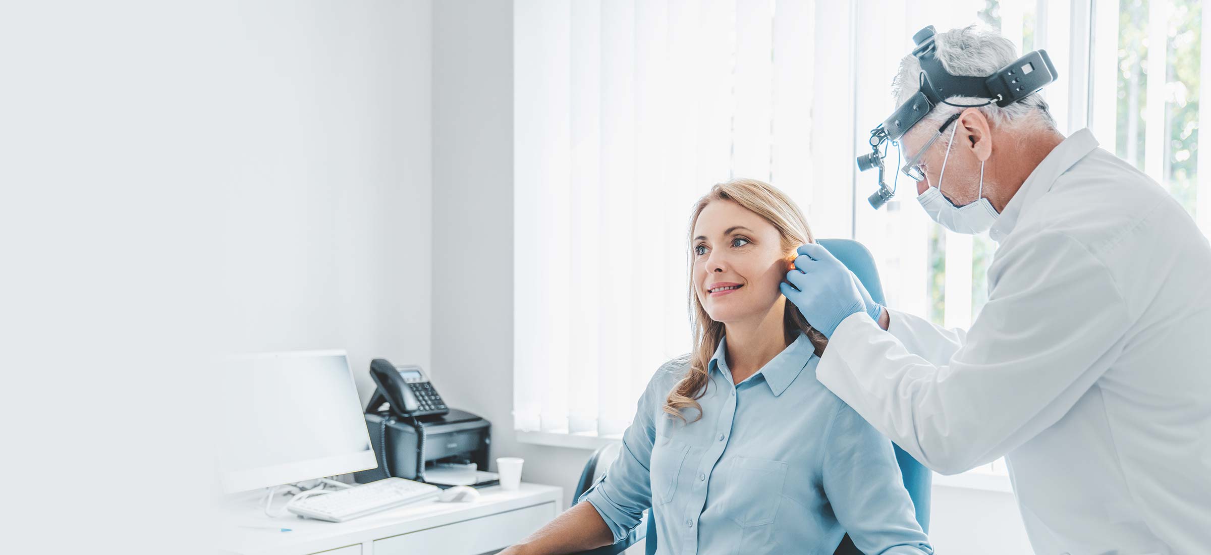 Physician checking a patient's ear