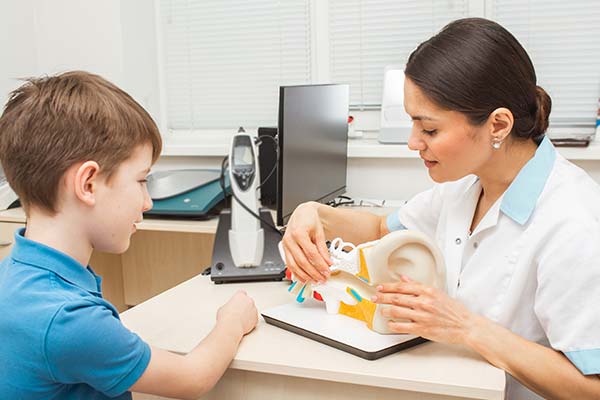 Child learning about parts of the ear