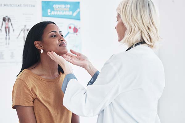 Person getting neck checked