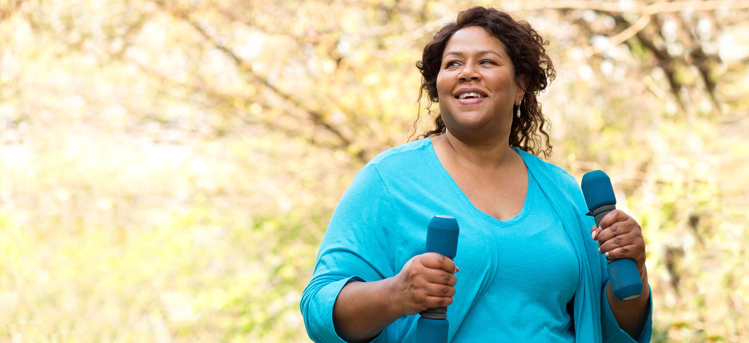 Person speed walking with dumbells