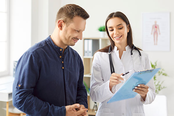 A man consults with his doctor about catheter ablation.